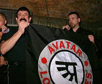 Lawrence presents Guy with a flag